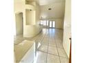 Spacious living room with tile floors, high ceilings, and modern lighting at 1906 Double Delight Ave, North Las Vegas, NV 89032