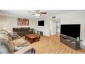 Inviting living room with sleek floors, ceiling fan, and neutral decor at 3261 Ennis Ct, Las Vegas, NV 89121