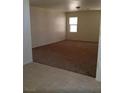 Spacious living room with neutral carpet and ample natural light at 3883 Winter Whitetail St, Las Vegas, NV 89122