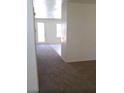 Spacious living room with neutral carpet and ample natural light at 3883 Winter Whitetail St, Las Vegas, NV 89122