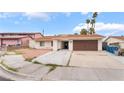 Single-story home with desert landscaping, driveway, and attached two-car garage at 3994 Ridgewood Ave, Las Vegas, NV 89120