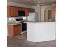 A well-equipped kitchen with modern appliances, a breakfast bar and ample counter space at 4732 Lone Grove Dr, Las Vegas, NV 89139