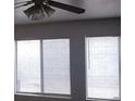 A ceiling fan is featured in the living room and natural light from the windows with blinds at 4732 Lone Grove Dr, Las Vegas, NV 89139