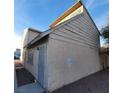 Exterior rear view of home showing wall texture and gated doorway at 5126 Golden Ln # A, Las Vegas, NV 89119