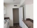 Kitchen featuring light countertops, cabinets and wood-style floors at 5126 Golden Ln # A, Las Vegas, NV 89119