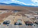 Wide aerial view showing the home and surrounding desert landscape at 6101 Cavalry Trl, Pahrump, NV 89060