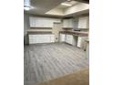 Spacious kitchen featuring ample white cabinets and countertops at 664 Sky Rd, Indian Springs, NV 89018