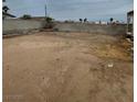 Vacant lot with concrete perimeter walls provides room for customization at 6733 E Carey Ave, Las Vegas, NV 89156