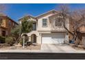 Charming two-story home with a well-maintained front yard and attached two-car garage at 6924 Ghost Ranch Ave, Las Vegas, NV 89179