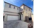 Charming two-story home featuring a neutral stucco facade, a two-car garage, and a well-maintained front yard at 731 Emerald Idol Pl, Henderson, NV 89011