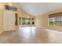 Bright and airy living room with large windows and neutral tile flooring, creating a seamless flow at 812 Eaglewood Dr, Las Vegas, NV 89144