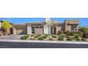 Beautiful single-story home featuring modern architecture, manicured landscaping and neutral color palette at 10048 Copper Edge Rd, Las Vegas, NV 89148