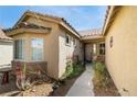 Inviting home entrance with pathway and decorative details, creating a welcoming first impression at 10576 Refugio St, Las Vegas, NV 89141