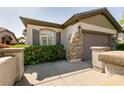 Beautiful home with a two-car garage and manicured landscaping at 11253 Piper Peak Ln, Las Vegas, NV 89138