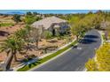 Aerial view of a property nestled in a lush community near a beautiful golf course at 165 Inveraray Ct, Henderson, NV 89074