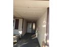 Covered front entrance with direct access from the driveway, featuring a storm door at 212 Bradshaw Way, Las Vegas, NV 89145