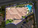 Aerial view of the property showcasing the pool, lush landscaping, and surrounding neighborhood at 2290 Casa Bella Ct, Las Vegas, NV 89117