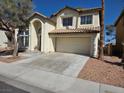 Charming two-story home featuring a tile roof, attached garage, and well-maintained landscaping at 2606 Heartland Ave, Henderson, NV 89074
