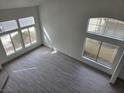 Bright, open living room with large windows, new floors, and plenty of natural light at 2606 Heartland Ave, Henderson, NV 89074