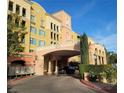 Beautifully landscaped entrance to a condo building with portico at 30 Strada Di Villaggio # 631, Henderson, NV 89011