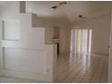 Living room boasts tiled floors, neutral paint, sliding glass doors with blinds, and a fireplace at 33 Newburg Ave, North Las Vegas, NV 89032