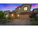 Attractive two-story home featuring neutral stucco, a two-car garage, and easy-care landscaping at 342 Molinetto St, Las Vegas, NV 89138