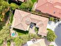 Aerial view of a home with a beautiful backyard, landscaping, stone patio, and private pool at 4 Annadale Ct, Henderson, NV 89052