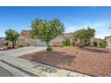 Expansive front yard showcasing mature trees and meticulous landscaping at 6131 Cozy Creek St, North Las Vegas, NV 89031
