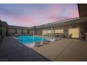 Sparkling pool with lounge chairs and covered patio, perfect for relaxing and entertaining at 647 Foxhall Rd, Henderson, NV 89002