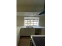 Modern kitchen features bright countertops, stainless sink and a large window at 7664 Angel Crest Cir, Las Vegas, NV 89117