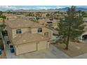 View of a landscaped house with tile roof and well-maintained front yard in a suburban setting at 8980 Tumbling Pebble Way, Las Vegas, NV 89123