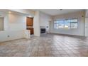 Living room with tile flooring, fireplace, and lots of natural light at 9632 Cherry Canyon Ave, Las Vegas, NV 89129