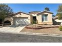 Charming single-story home boasts a well-maintained front yard and a welcoming facade at 10516 Angel Dreams Ave, Las Vegas, NV 89144