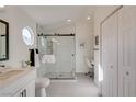 Bright bathroom featuring updated shower with glass door, modern fixtures, and stylish tile floors at 1100 Meridian Bay Dr, Las Vegas, NV 89128