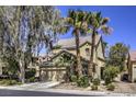 Stunning home showcasing mature landscaping, lush trees, and a welcoming facade at 11215 Piazzale St, Las Vegas, NV 89141