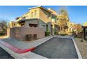 Exterior view of the townhome with its modern architecture and private parking at 11297 Essence Point Ave # 102, Las Vegas, NV 89135