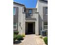 Inviting front exterior showcasing the entryway with a small balcony and brick pathway at 1197 Mission View Ct, Henderson, NV 89002