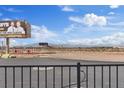 Real estate view from the property showing the desert landscape and billboard advertising realtors at 12108 Harvest Sky Way # 1, Las Vegas, NV 89183