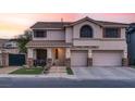 Charming two-story home with a well-manicured lawn, a two-car garage, and a welcoming front porch, perfect for families at 1283 Peppercorn Ave, Henderson, NV 89012