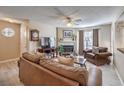 Living room showcasing a fireplace, ceiling fan, and cozy seating at 1375 E Hacienda Ave # 114, Las Vegas, NV 89119