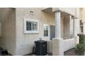 Exterior of home features a covered patio area and an energy-efficient HVAC unit at 1947 Cutlass Dr # 0, Henderson, NV 89014