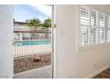 View through a doorway showing the community pool and palm trees from inside the apartment at 204 Orland St # 2, Las Vegas, NV 89107