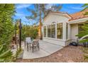 Cozy backyard patio area with outdoor seating and lush landscaping, perfect for entertaining at 2292 Cassatt Dr, Henderson, NV 89074
