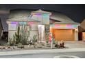 Charming single-story home adorned with festive multi-colored holiday lights at 3096 Beaux Art Ave, Henderson, NV 89044