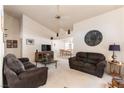Spacious living room with high ceilings, comfortable seating, and an open floor plan at 364 Rushing Creek Ct, Henderson, NV 89014