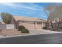 Single-story home featuring a neutral color palette, low maintenance landscaping, and a two-car garage at 6032 Port Of Dreams Dr, Las Vegas, NV 89130