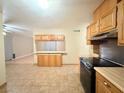Open concept kitchen and dining area with tile floors at 6248 Dayton Ave, Las Vegas, NV 89107