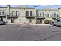 View of condo parking, showcasing neat rows and ample parking spaces and building design at 7030 Burcot Ave # D106, Las Vegas, NV 89156