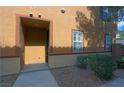 Home's front door with an inviting entryway and desert landscaping at 7322 Fools Gold St # 102, Las Vegas, NV 89149