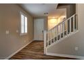 Inviting foyer with wood-look flooring and staircase at 7322 Fools Gold St # 102, Las Vegas, NV 89149